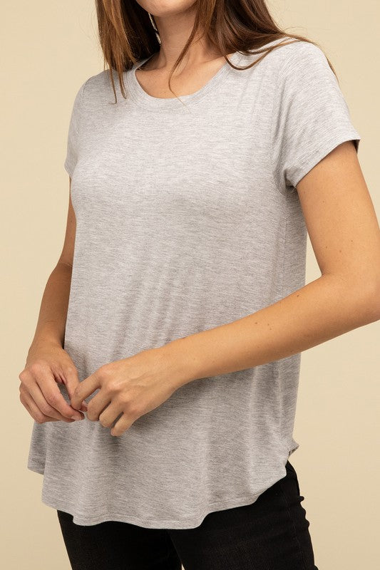 Flowy Round Hem Rayon Short Sleeve TopThe Flowy Round Hem Rayon Short Sleeve Top is the perfect addition to your casual wardrobe. Crafted from soft, lightweight rayon, this top features a relaxed fit and