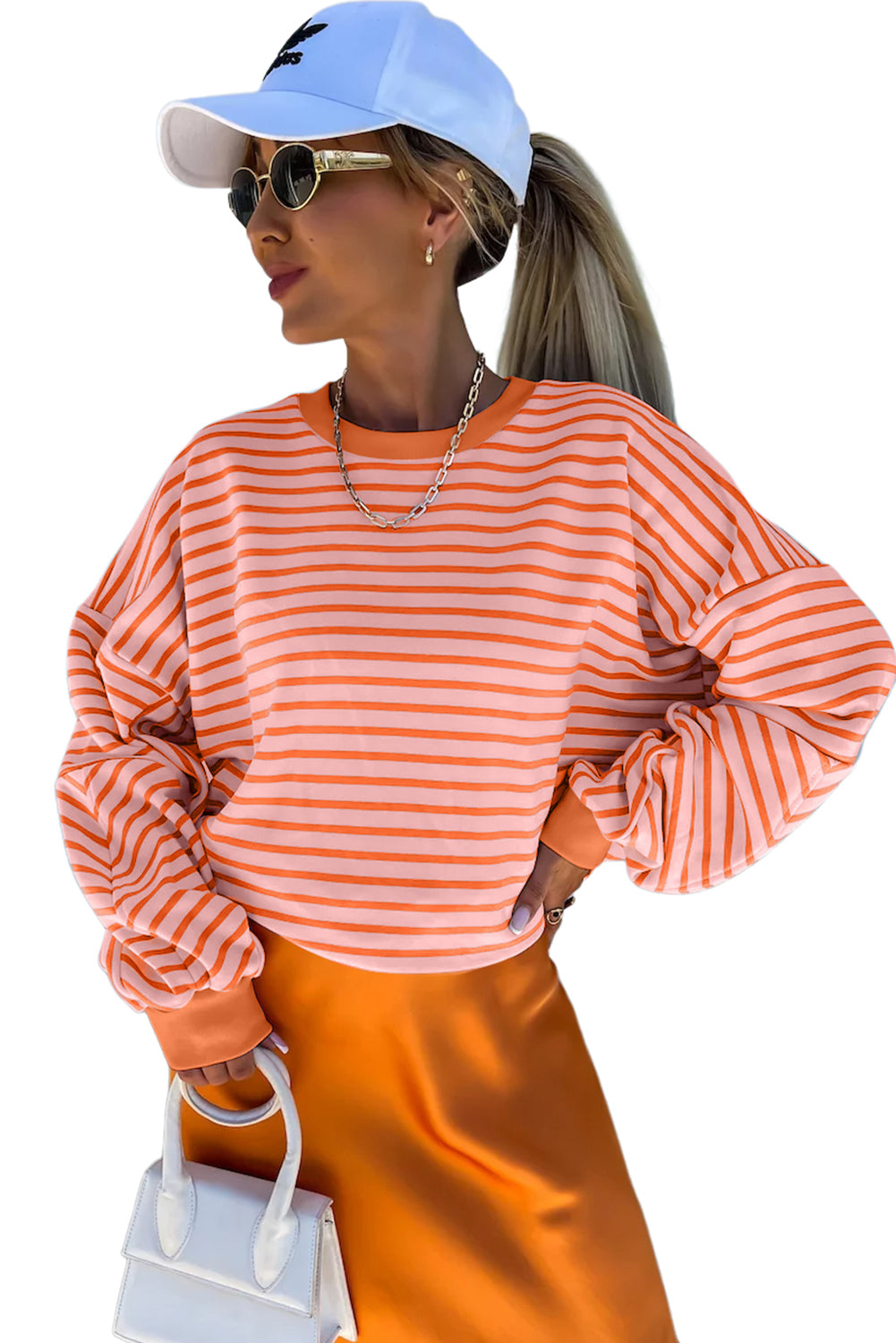 Russet Orange Drop Shoulder Crew Neck Loose SweatshirtMaterial:70%Polyester+25%Cotton+5%Elastane

• Stand out with the vibrant sweatshirt, featuring a unique colorblock design that adds a playful touch to your outfit.
