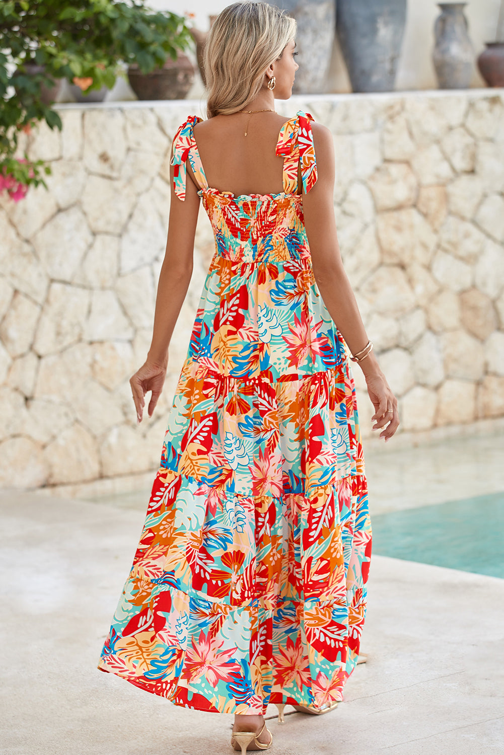 Multicolor Boho Tropical Print Smocked Ruffle Tiered Maxi DressMaterial:100%Polyester



		•The tiered design of the dress adds volume, creating a flowy and feminine look.
	
	
		•Smocked bodice and tie shoulder straps give 