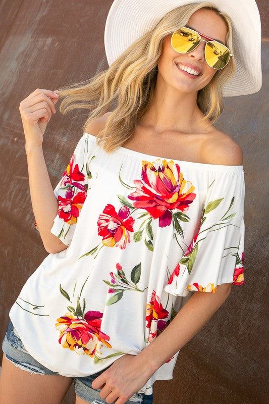 FLORAL OFF SHOULDER TOPFLORAL PRINT JERSEY ELASTICIZED OFF SHOULDER TOP- Floral off shoulder top- Elasticized off shoulder neckline- Ruffle short sleeves- Loose fit- Allover floral print j