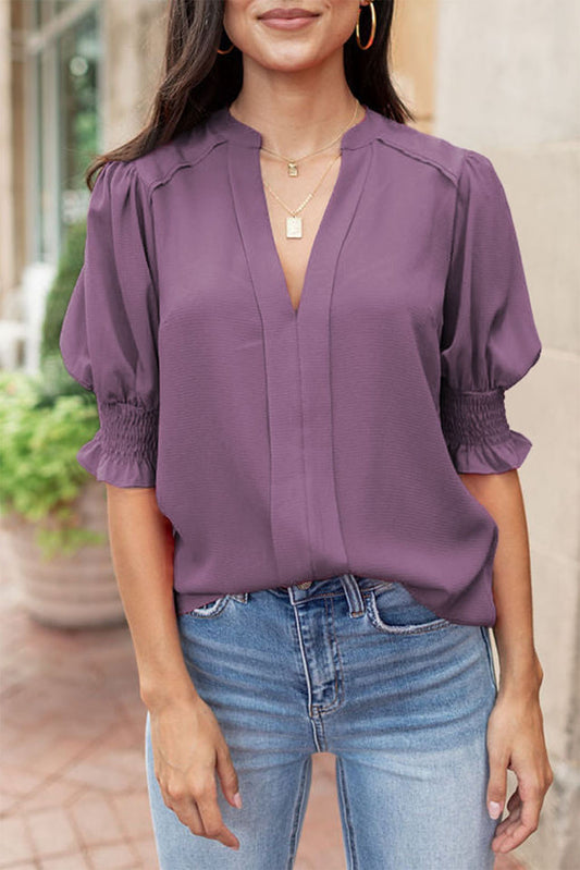 Purple Solid Color Half Sleeve Shirred V Neck BlouseMaterial:100%Polyester



		This solid color blouse allows you to show off an elegant look
	
	
		Featured with v-neckline, puffy sleeves, smocked cuffs, and reg