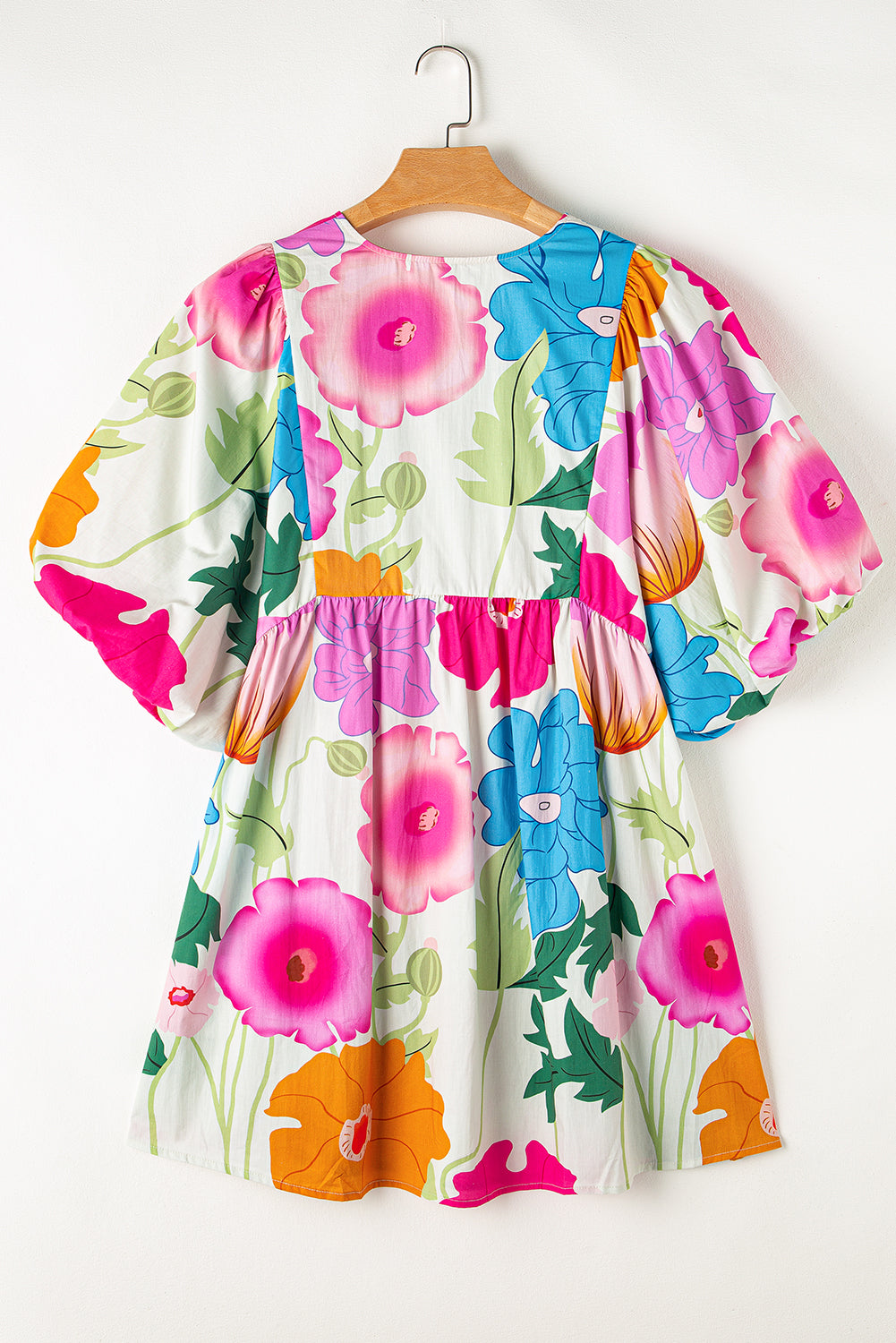 White Puff Sleeve Tied Split Neck Colorful Floral Flowy DressMaterial:100%Cotton


	


		Step into elegance with our mini dress, a vibrant and feminine piece designed to make a statement.
	
	
		This dress features charm