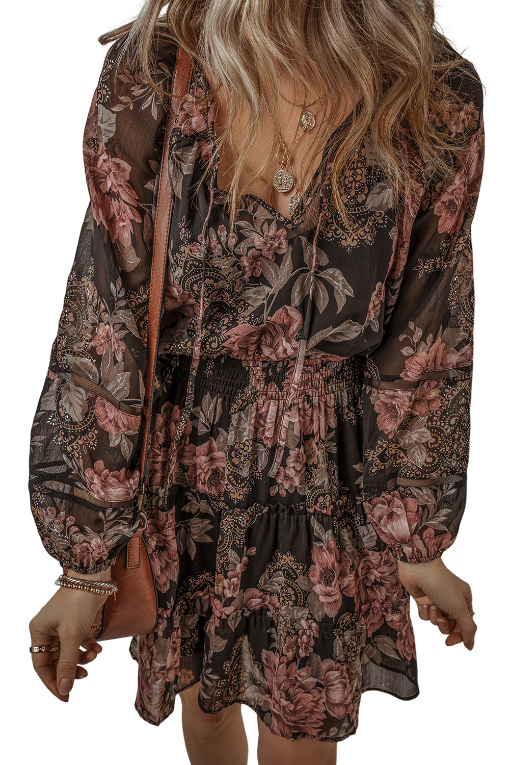 Black Floral Puff Sleeve V Neck Smocked Waist Mini DressMaterial:100%Polyester

• Embrace the essence of bohemian style with this dress, featuring a charming floral print that adds a touch of femininity.
• The V-necklin