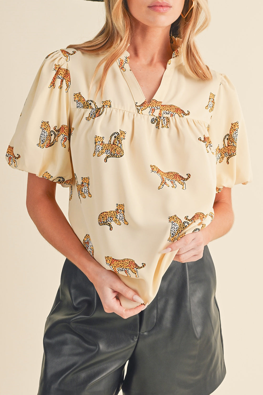 Apricot Animal Print V Neck Puff Sleeve BlouseMaterial:100%Polyester



		The blouse features an animal print pattern, which adds a bold and eye-catching element to the design. 
	
	
		Animal prints, such as