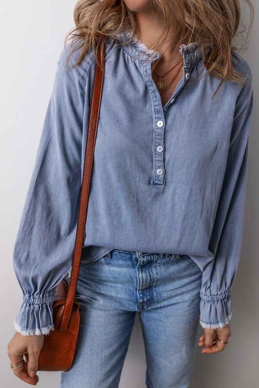 Sky Blue Frilled Raw Hem Half Buttoned Denim TopMaterial:100%Cotton

• Elevate your casual look with this top, featuring a half-buttoned front that adds a touch of chic charm to your outfit.
• The frilled hem de