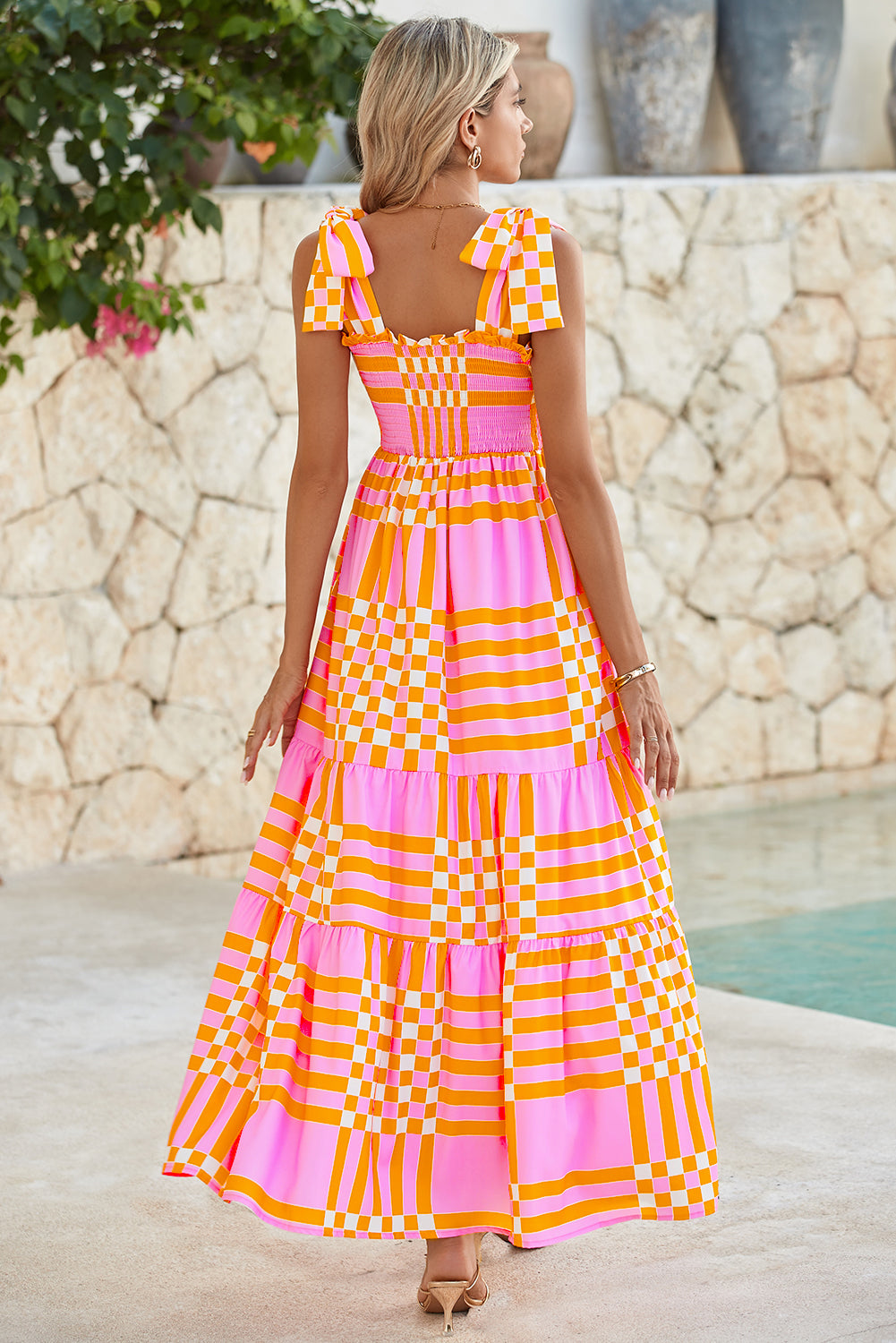 Pink Tie Strap Plaid & Striped Smocked Maxi DressMaterial:100%Polyester



		Embrace the sunshine with this flowy long dress
	
	
		It’s a elegantly flared dress with tiered skirt and self-tie straps
	
	
		F