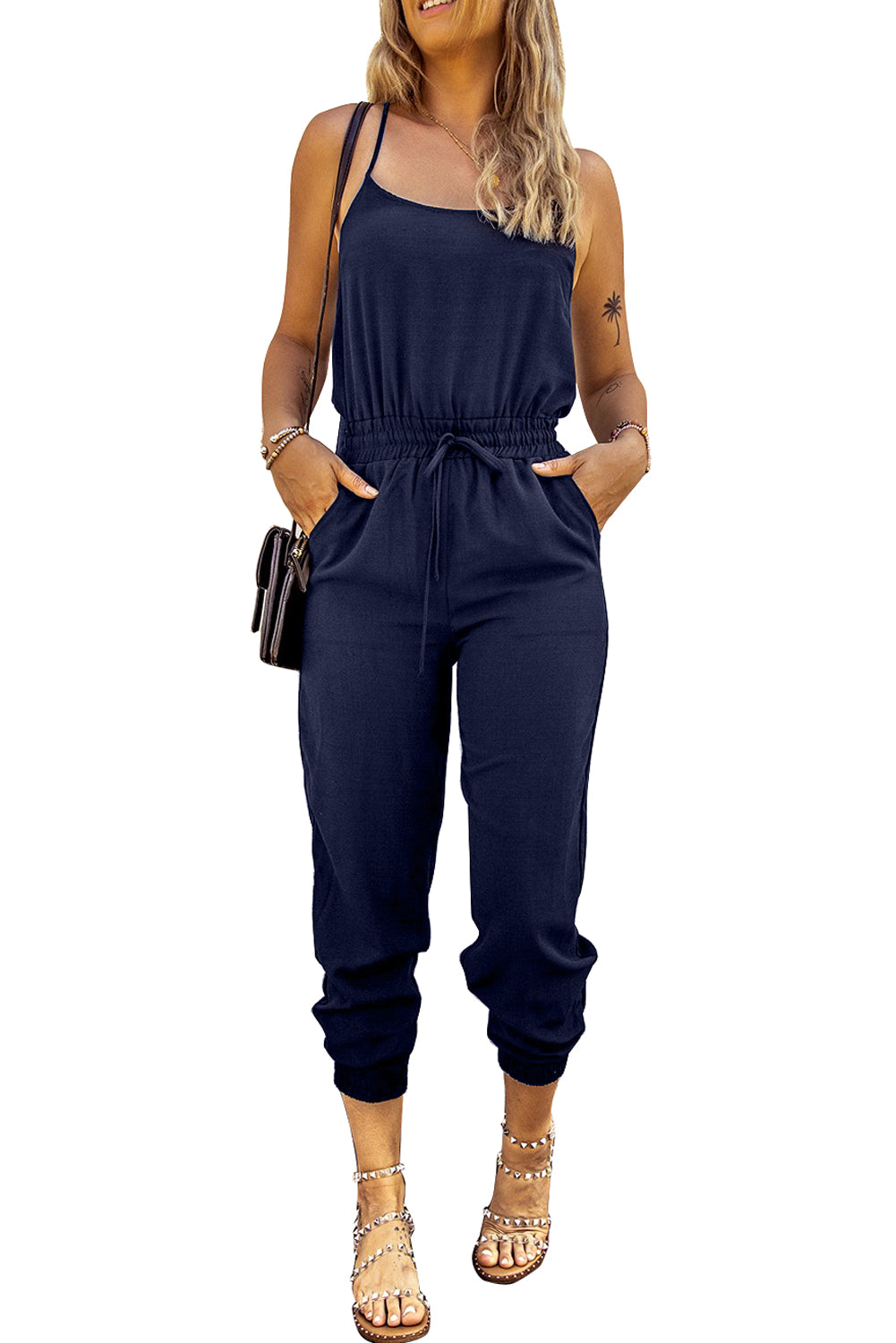 Dark Blue Pockets Drawstring Waist Spaghetti Strap JumpsuitMaterial:95%POLYESTER+5%ELASTANE



		An amazing jumpsuit to make customers feel chic and slim
	
	
		Spaghetti straps design is flirty and sexy
	
	
		Flatter