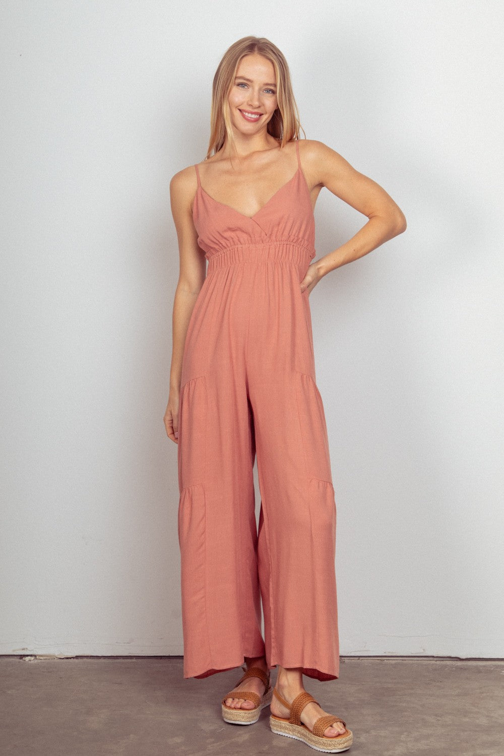 VERY J Sleeveless Ruched Wide Leg JumpsuitThe Woven Wide Leg Jumpsuit is a stylish and versatile outfit option. This sleeveless jumpsuit features adjustable straps for a customizable fit. The elastic waist a