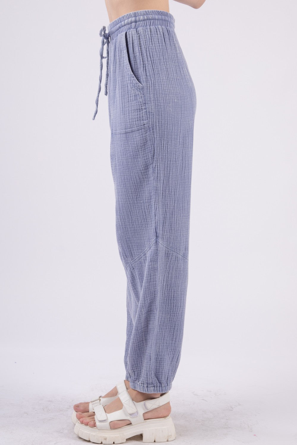 VERY J Washed Woven Crinkle Gauze Drawstring Cargo PantsStep out in style and comfort with these washed woven crinkle gauze cargo pants featuring a utility design that is both trendy and practical. The elastic waist and d