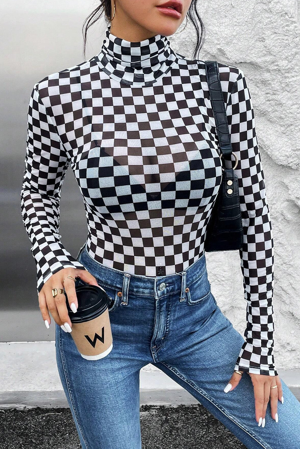 Black Checkered Print Long Sleeve Mock Neck BodysuitMaterial:95%Polyester+5%Elastane

• Embrace timeless style with our bodysuit, perfect for a casual yet chic look.• The mock neck design adds a touch of sophisticati