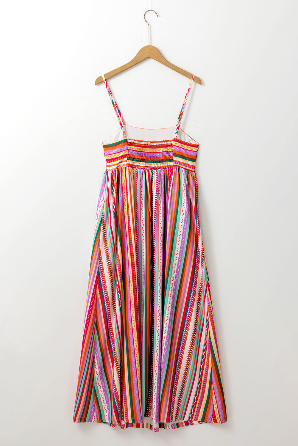 Multicolour Boho Striped Spaghetti Strap Smocked Back Maxi DressMaterial:100%Polyester

• Embrace a vibrant blend of colors in this maxi dress, perfect for daily wear with its relaxed, sleeveless design.
• The shirred back ensu