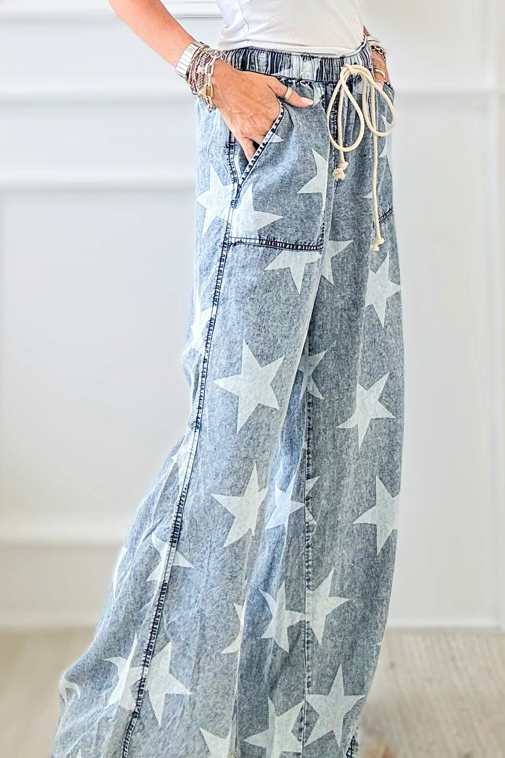 Light Blue Star Print Light Wash Drawstring High Waist Wide Leg JeansMaterial:82%Cotton+10%Polyester+8%Viscose

• Elevate your casual look with these light blue star print high waist jeans, featuring a trendy wide leg design for a ch