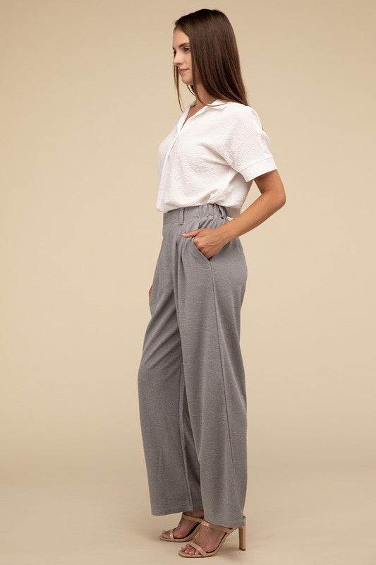 Waffle Trouser PantsElevate your everyday style with these waffle trouser pants. Crafted from textured waffle-knit fabric, they offer a perfect blend of comfort and sophistication. The 