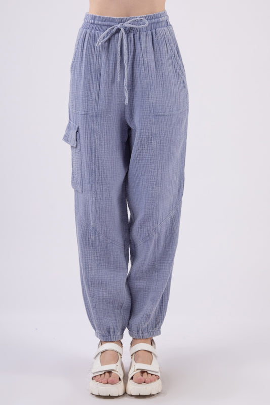 VERY J Washed Woven Crinkle Gauze Drawstring Cargo PantsStep out in style and comfort with these washed woven crinkle gauze cargo pants featuring a utility design that is both trendy and practical. The elastic waist and d