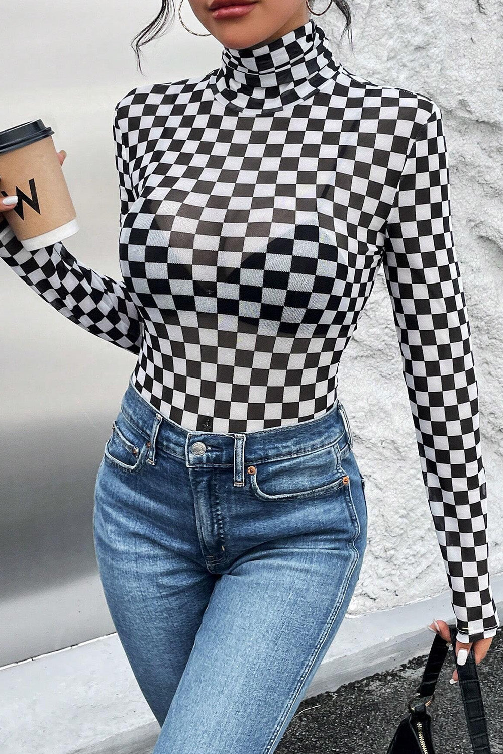 Black Checkered Print Long Sleeve Mock Neck BodysuitMaterial:95%Polyester+5%Elastane

• Embrace timeless style with our bodysuit, perfect for a casual yet chic look.• The mock neck design adds a touch of sophisticati