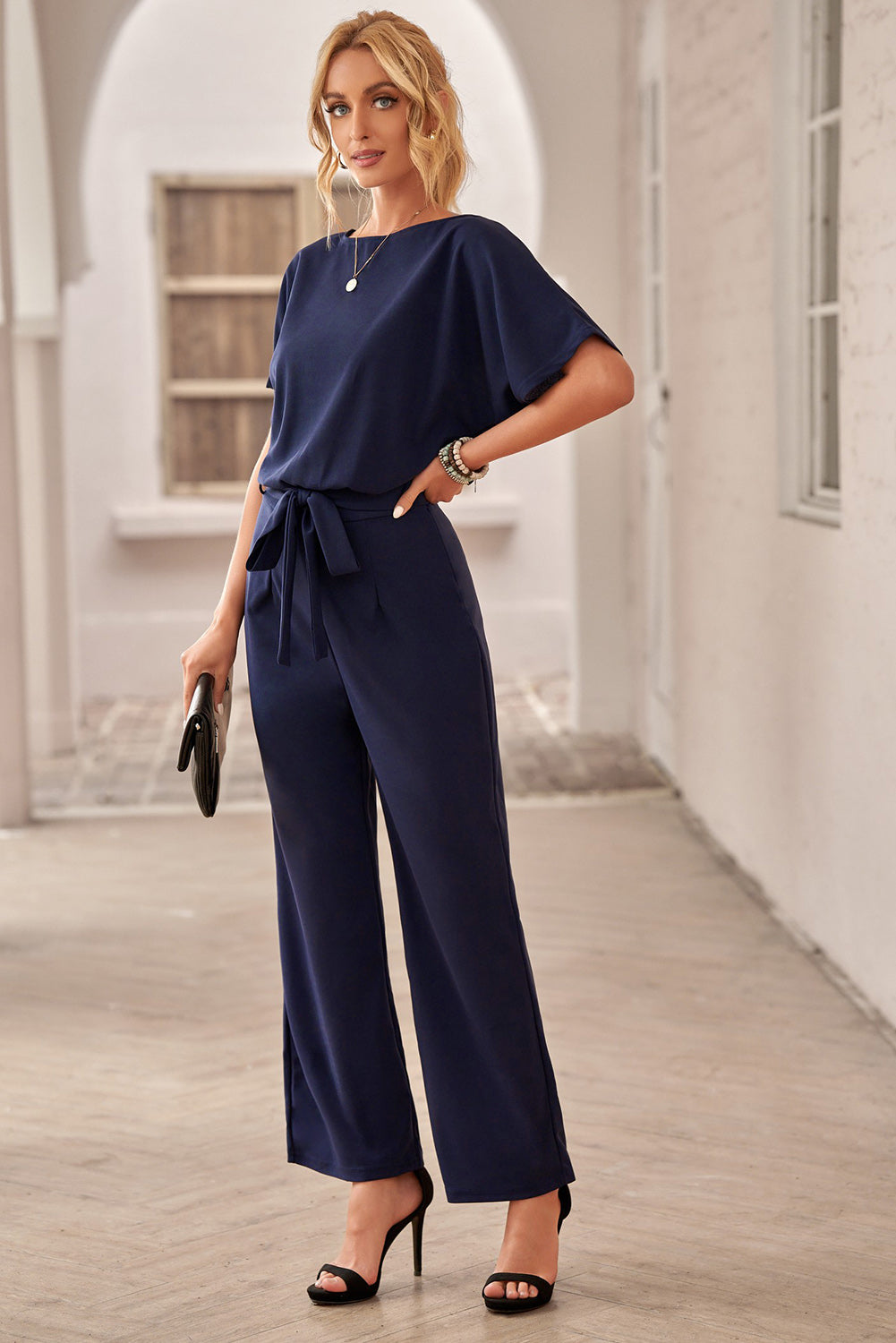 Dark Blue Solid Color Casual Belted Wide Leg JumpsuitMaterial:95%Polyester+5%Spandex



		You'll be looking oh so glam in this beaut jumpsuit
	
	
		A tie waist belt, batwing sleeve and wide leg
	
	
		The loose 