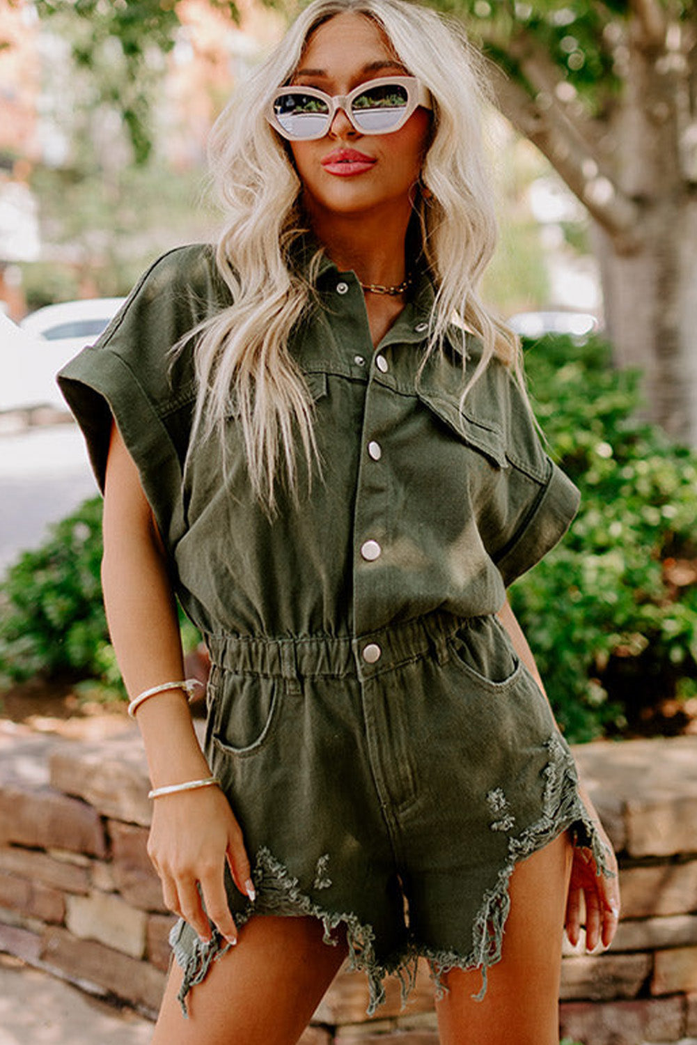 Moss Green Distressed Frayed Denim RomperMaterial:98%Cotton+2%Elastane

• This romper offers a comfortable and stretchy fit for all-day wear.
• The moss green hue brings a touch of nature-inspired charm, 