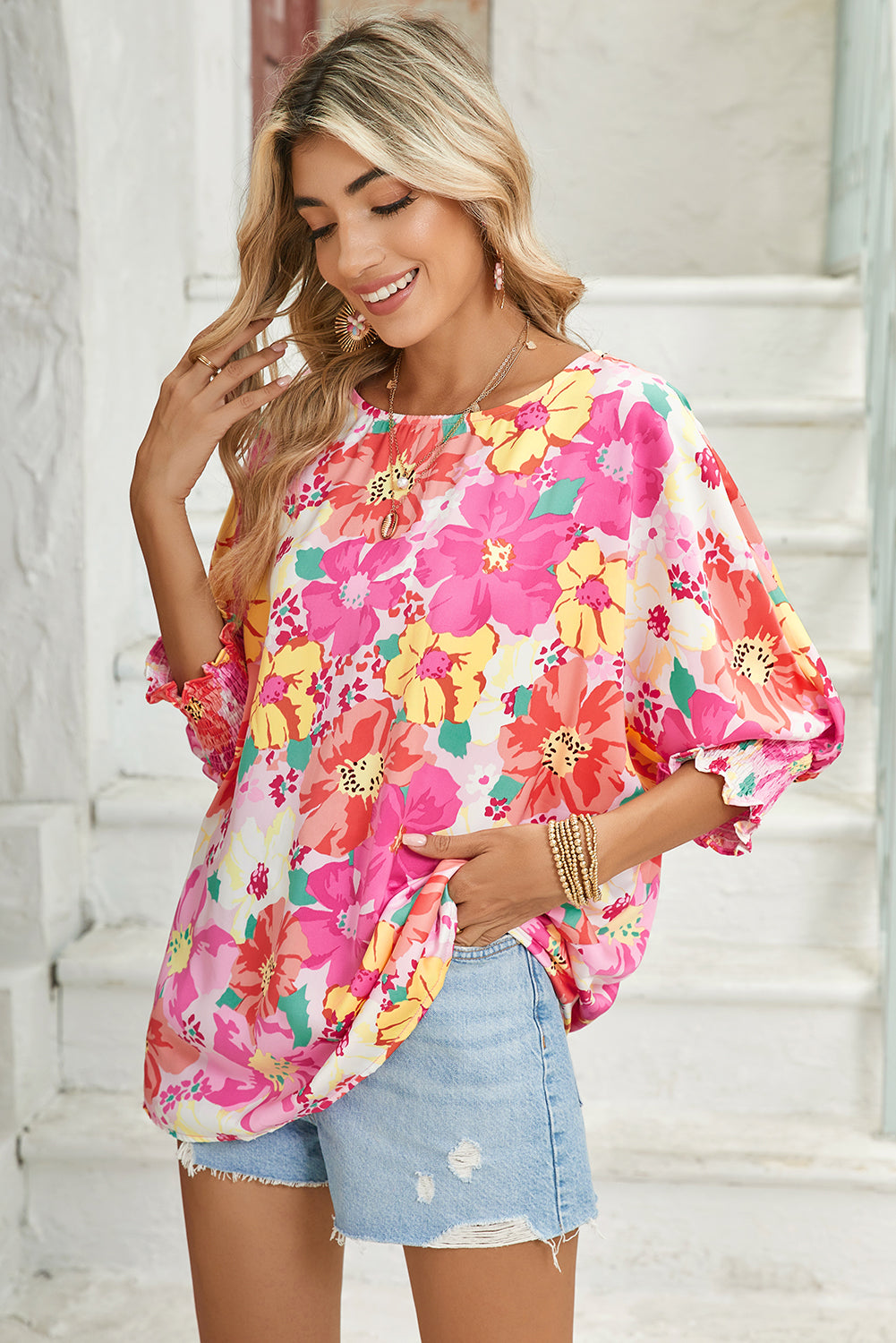 Pink Shirred Cuffs 3/4 Sleeve Boho Floral BlouseMaterial:100%Polyester



		The blouse is a stylish and feminine top featuring shirred cuffs and a boho-inspired floral print, adding a touch of bohemian charm to 