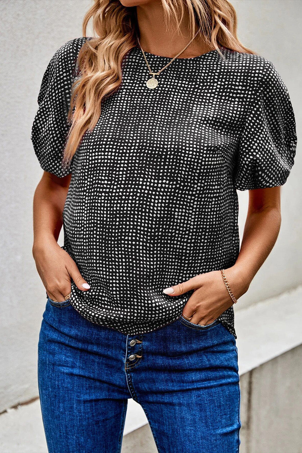 Black Dotted Puff Sleeve Round Neck BlouseMaterial:100%Polyester



		This blouse is designed with puff sleeves, which are characterized by their voluminous and gathered appearance.
	
	
		The blouse is 