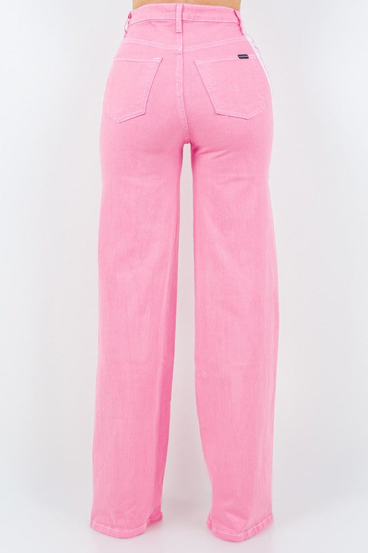 Striped Jean in PinkStep up your denim game with our Striped Wide Leg Jean in Pink! These stylish pants feature a high rise fit, front and back pockets, and a front button and zipper cl