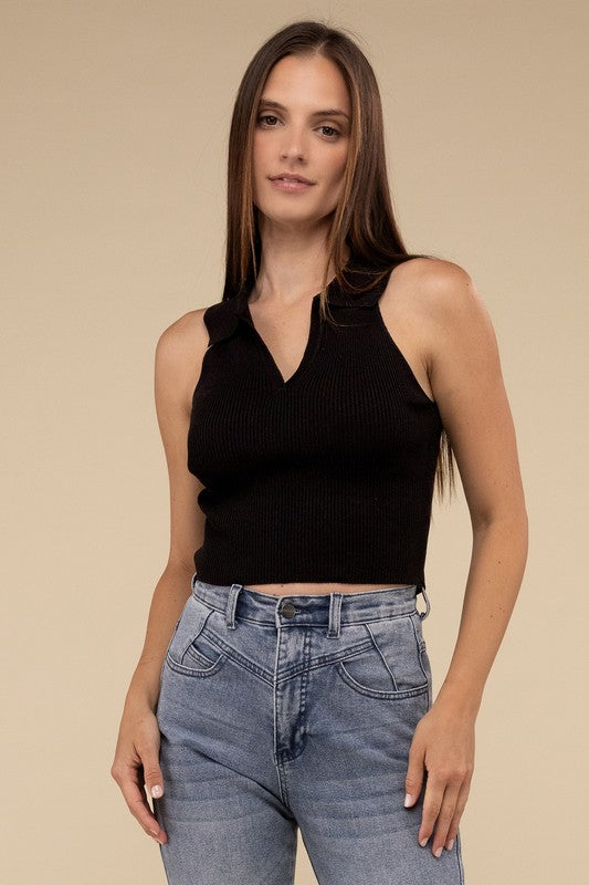 Sleeveless Collared Crop Knit TopThe Sleeveless Collared Crop Knit Top exudes timeless elegance and sophistication. Its tailored design features a classic collared neckline, adding a touch of refine