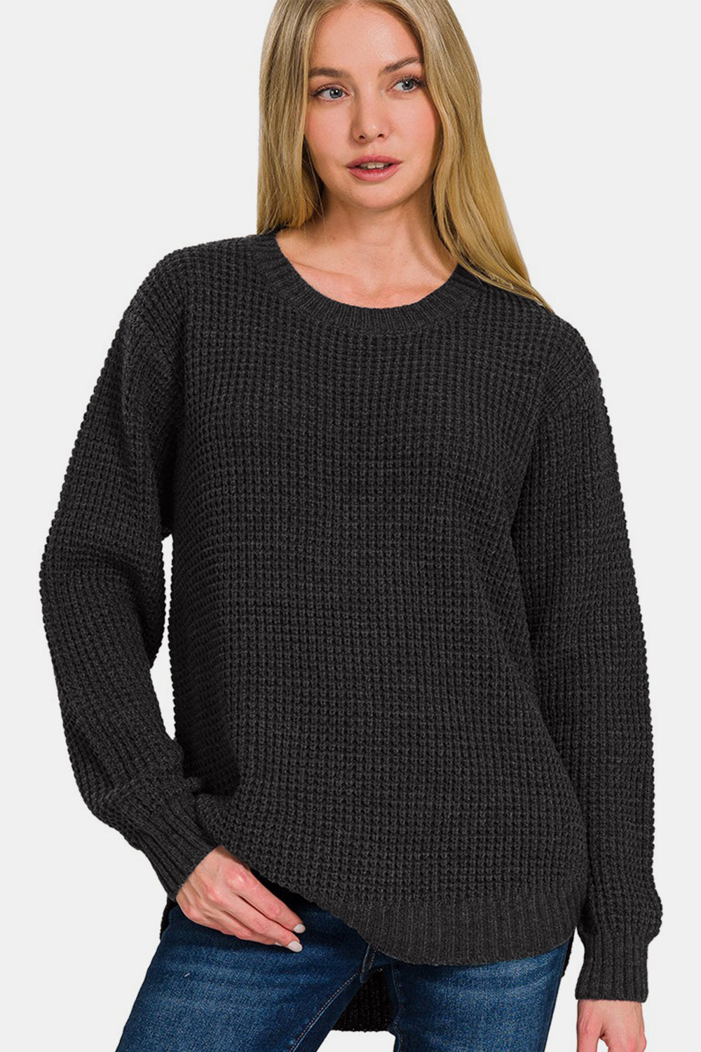 Zenana High Low Long Sleeve Waffle SweaterStay cozy and chic in this High Low Long Sleeve Waffle Sweater. With its unique waffle texture and flattering high-low hemline, this sweater is perfect for casual da