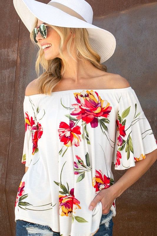 FLORAL OFF SHOULDER TOPFLORAL PRINT JERSEY ELASTICIZED OFF SHOULDER TOP- Floral off shoulder top- Elasticized off shoulder neckline- Ruffle short sleeves- Loose fit- Allover floral print j