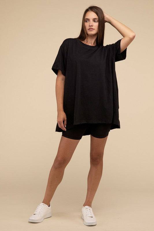 Cotton Drop Shoulder Oversized TopThe Cotton Drop Shoulder Oversized Top is a chic and comfortable addition to your wardrobe. With raw edge details adding a touch of edge, this top offers a relaxed, 