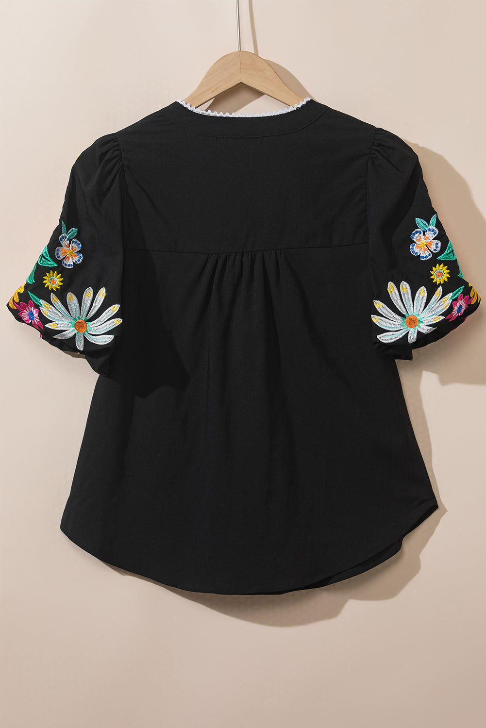 Mineral Red Floral Embroidered Puff Sleeve Split Neck BlouseMaterial:100%Cotton

• Radiate bohemian charm with the Mineral Red blouse featuring intricate floral embroidery and puff sleeves, perfect for a free-spirited look.
