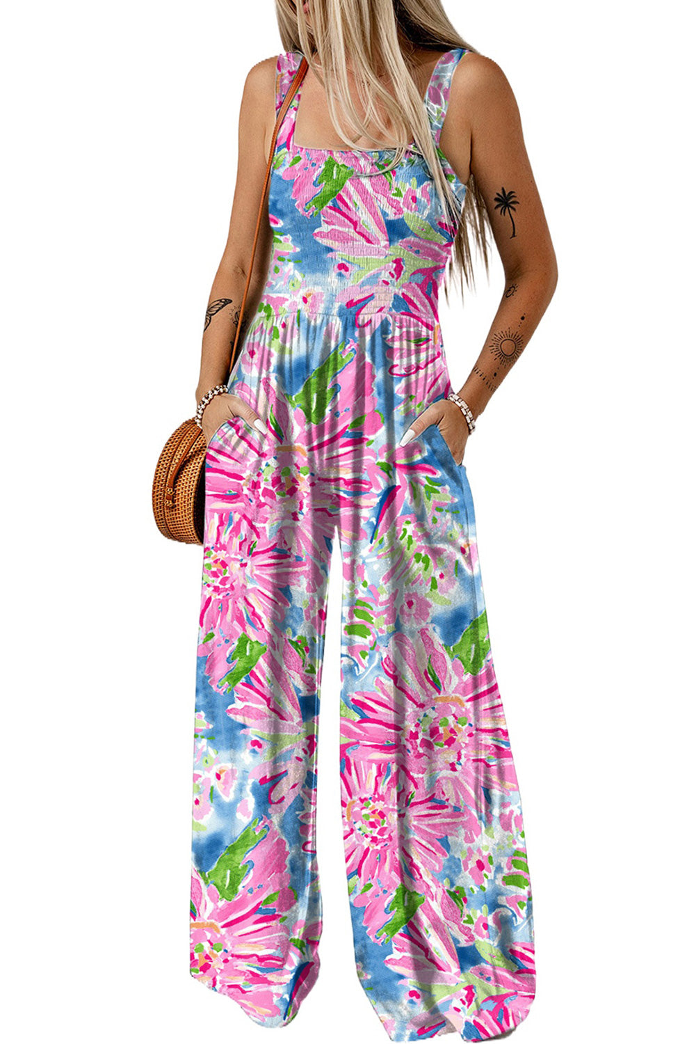 Pink Abstract Floral Painting Smocked Wide Leg JumpsuitMaterial:100%Polyester



		The jumpsuit features a colorful abstract floral print that adds a playful touch to the piece. 
	
	
		The smocked bodice creates a f