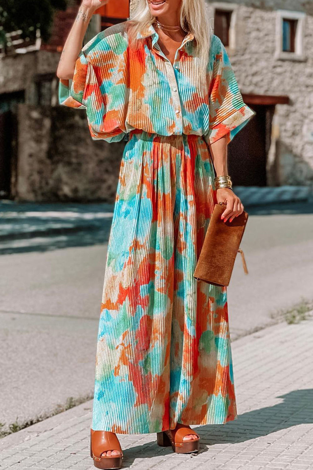 Multicolor Bohemian Tie Dye Pleated Wide Leg JumpsuitMaterial:100%Polyester



		•Made of soft and flowy fabric for comfort and movement.
	
	
		•Features a pleated design for a flattering fit.
	
	
		•Wide leg c