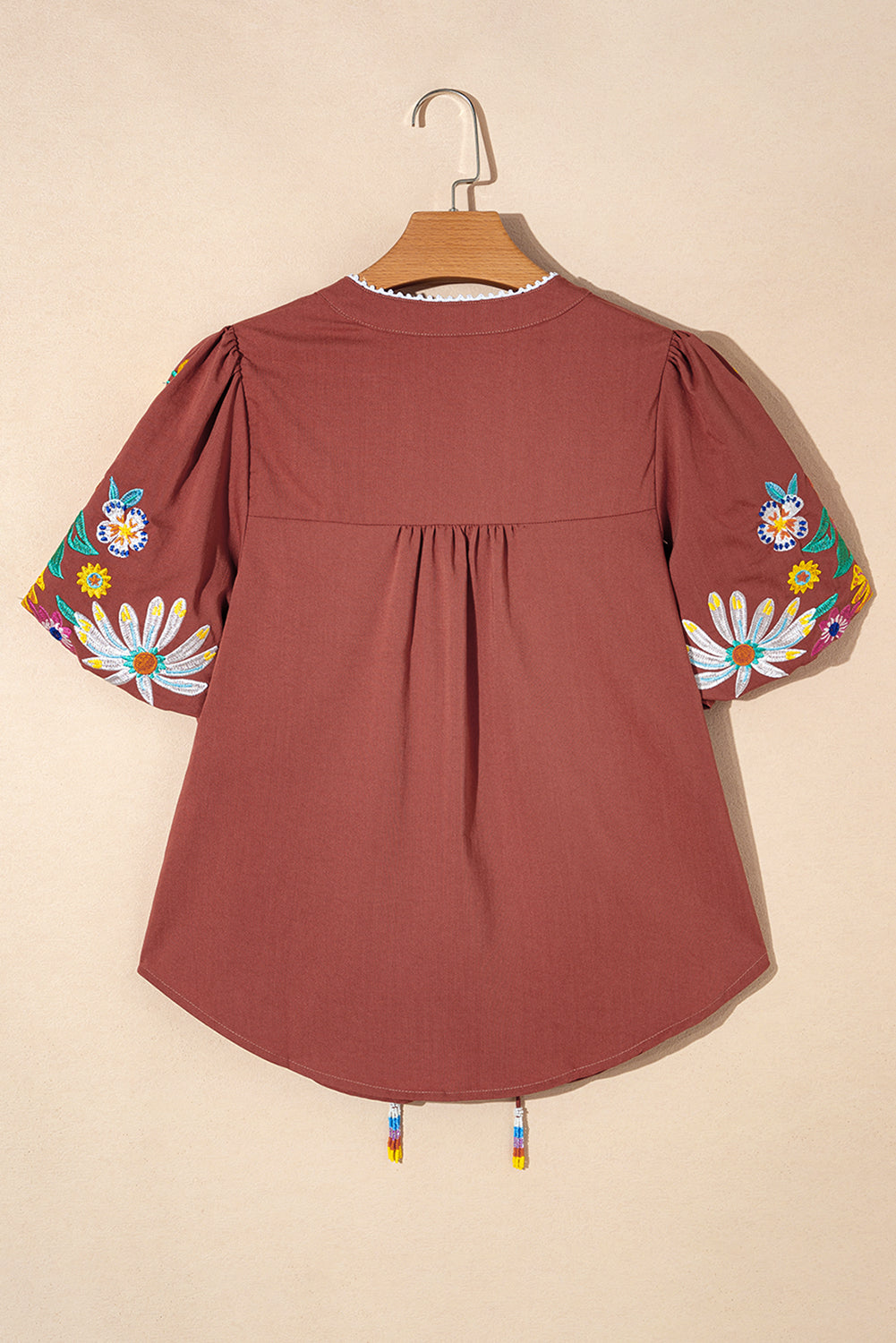 Mineral Red Floral Embroidered Puff Sleeve Split Neck BlouseMaterial:100%Cotton

• Radiate bohemian charm with the Mineral Red blouse featuring intricate floral embroidery and puff sleeves, perfect for a free-spirited look.
