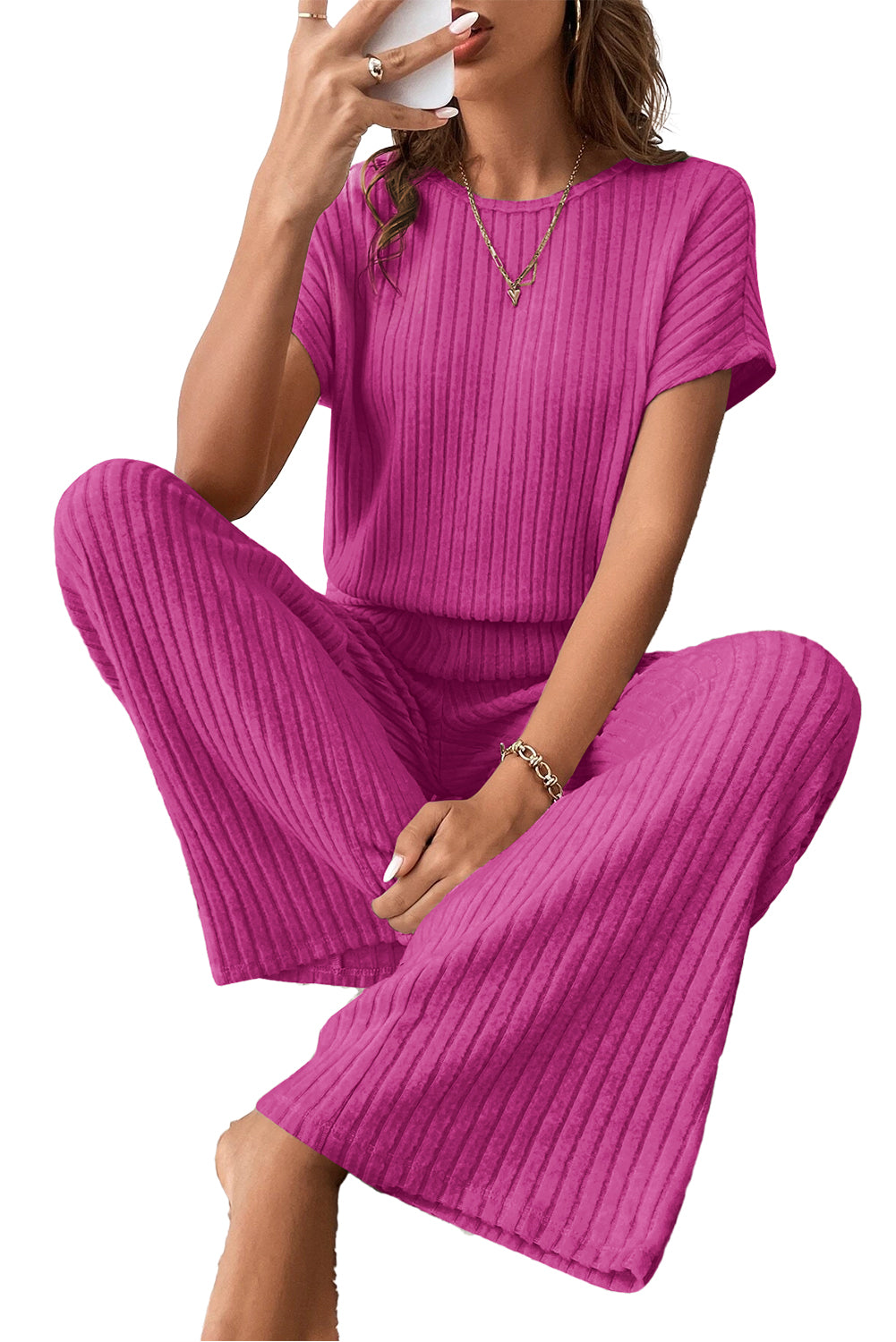 Grass Green Solid Color Ribbed Short Sleeve Wide Leg JumpsuitMaterial:85%Polyester+10%Viscose+5%Elastane



		The jumpsuit is a versatile and trendy one-piece outfit, featuring a solid color design that offers a sleek and mi