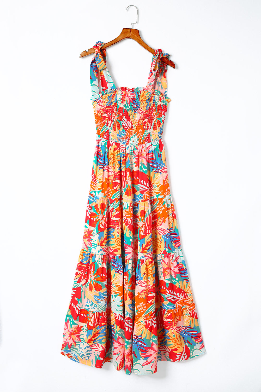 Multicolor Boho Tropical Print Smocked Ruffle Tiered Maxi DressMaterial:100%Polyester



		•The tiered design of the dress adds volume, creating a flowy and feminine look.
	
	
		•Smocked bodice and tie shoulder straps give 