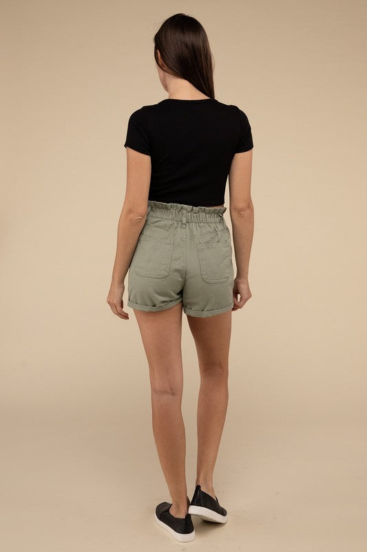 Double Buttoned Waistband Denim ShortsThe Double Buttoned Waistband Denim Shorts are a stylish and comfortable addition to your wardrobe. Featuring a unique double-button closure and a charming ruffled w