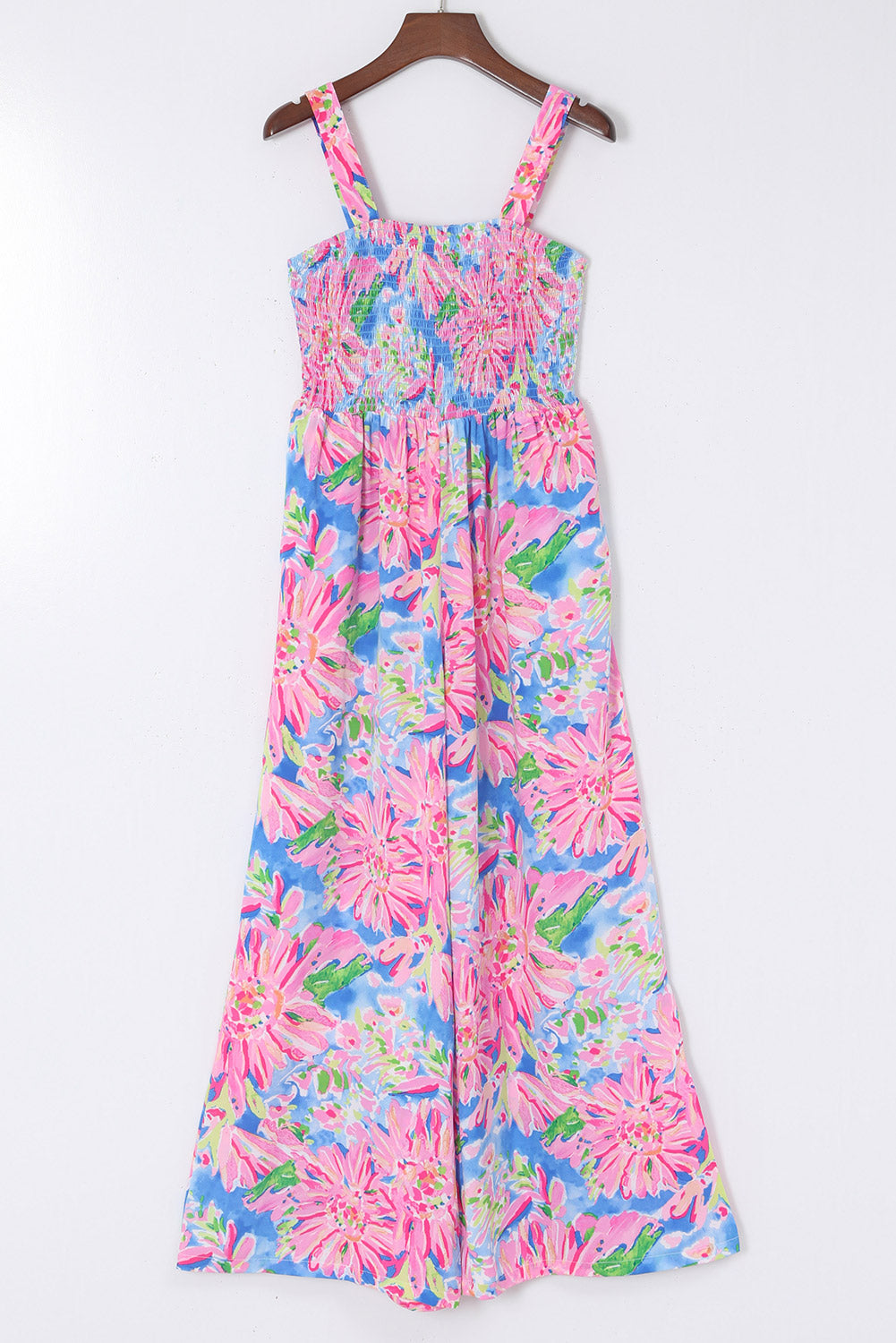 Pink Abstract Floral Painting Smocked Wide Leg JumpsuitMaterial:100%Polyester



		The jumpsuit features a colorful abstract floral print that adds a playful touch to the piece. 
	
	
		The smocked bodice creates a f