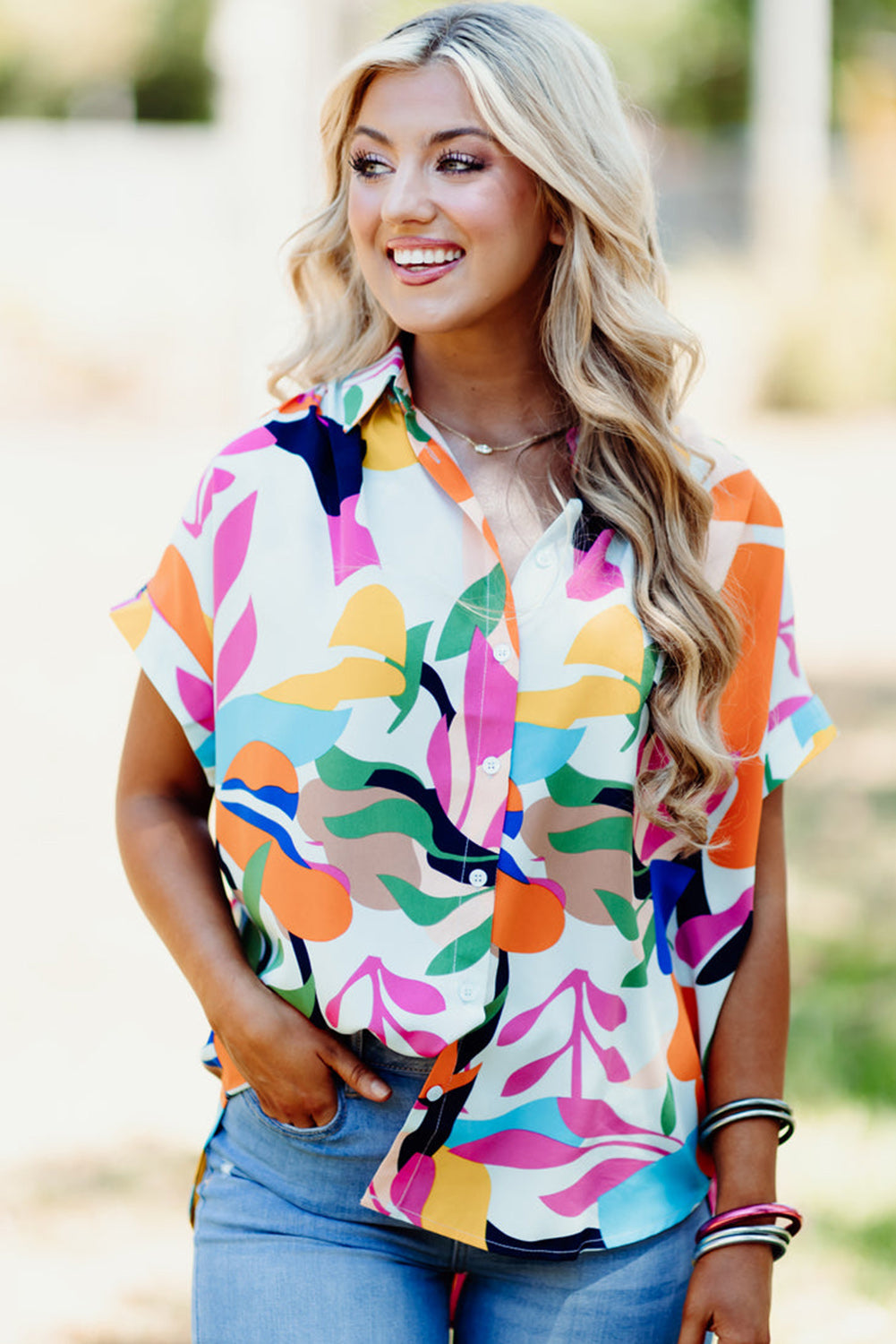 Multicolour Abstract Leaf Print Button Up Short Sleeve BlouseMaterial:100%Polyester

• Infuse your wardrobe with vibrancy in this blouse, perfect for a relaxed yet stylish look.
• The button-up design adds a touch of sophist