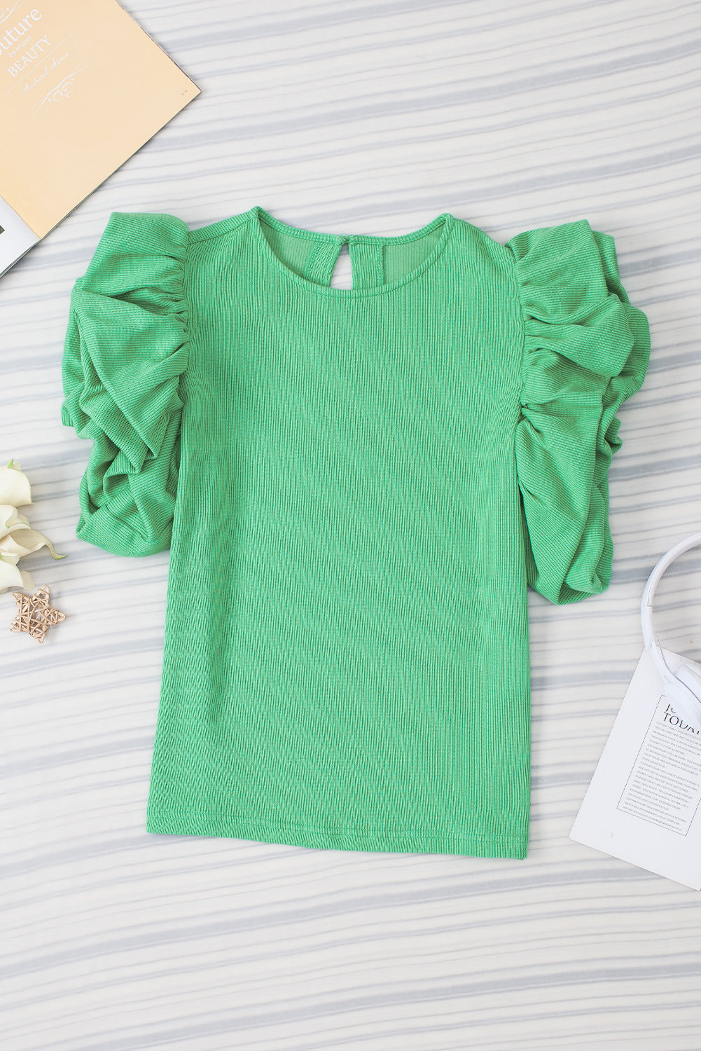 Green Solid Color Ruffle Sleeve Ribbed BlouseMaterial:65%cotton+33%polyester+2%Elastane



		The blouse features ruffle sleeves, which add a playful and romantic touch to the overall design. 
	
	
		The sol