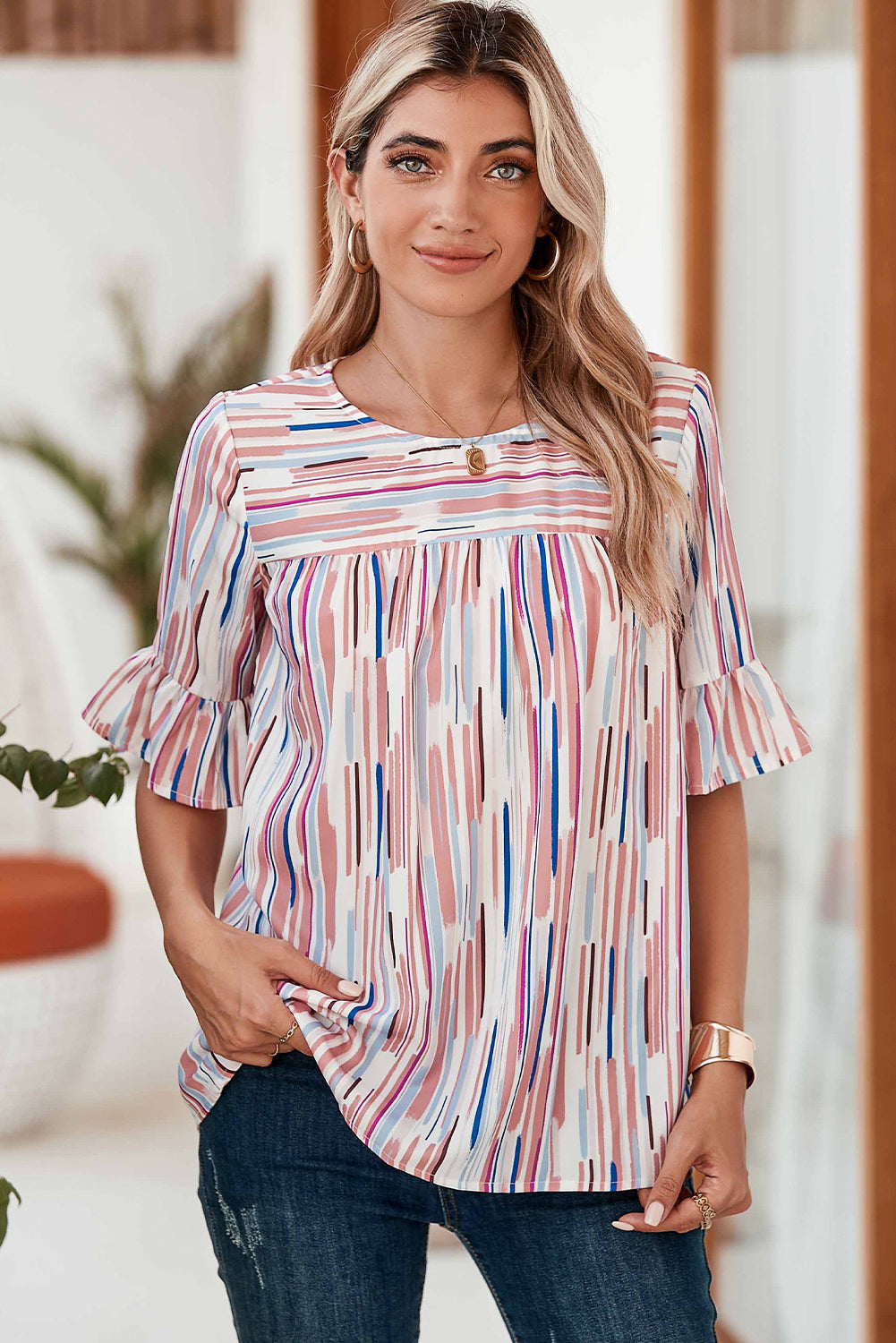 White Abstract Print Ruffle Half Sleeve BlouseMaterial:100%Polyester



		The blouse features a colorblock design, where different colors are strategically placed to create a visually striking contrast. 
	
	