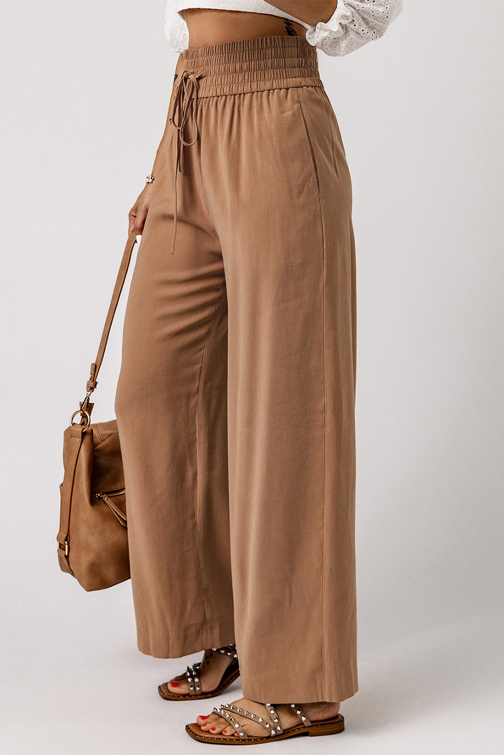 Blue Casual Drawstring Shirred Elastic Waist Wide Leg PantsMaterial:65%Viscose+35%Polyester



		These wide leg pants
are casual and comfy with a loose fit style
	
	
		The smocked waist
design is fashionable and very 