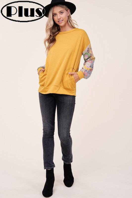 PLUS WOVEN FLORAL MIXED TOPFRENCH TERRY SOLID AND WOVEN FLORAL PRINT MIXED LONG SLEEVE SIDE POCKET RAW EDGE DETAIL PLUS TOP 
Style: Casual
Print / Pattern: SOLID AND WOVEN FLORAL 
Fit: Regular