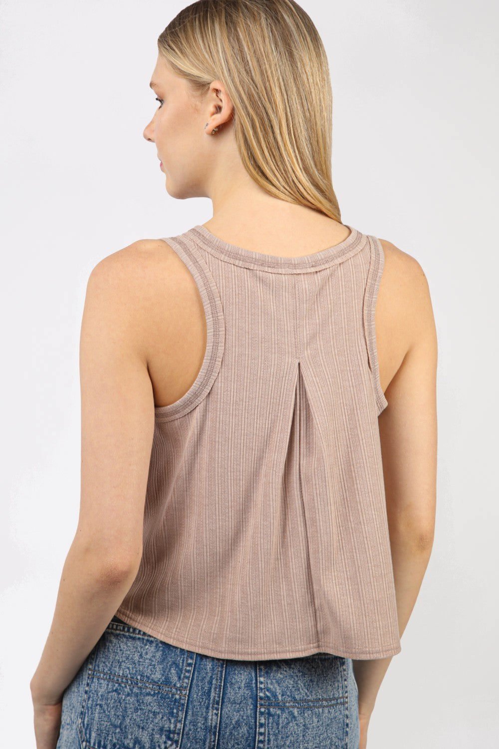 VERY J V-Neck Knit Swing Cropped TankLook effortlessly chic in this Sleeveless Soft Knit Swing Crop Top featuring raw edge detail, designed to add a touch of casual charm to your outfit. This soft girlc