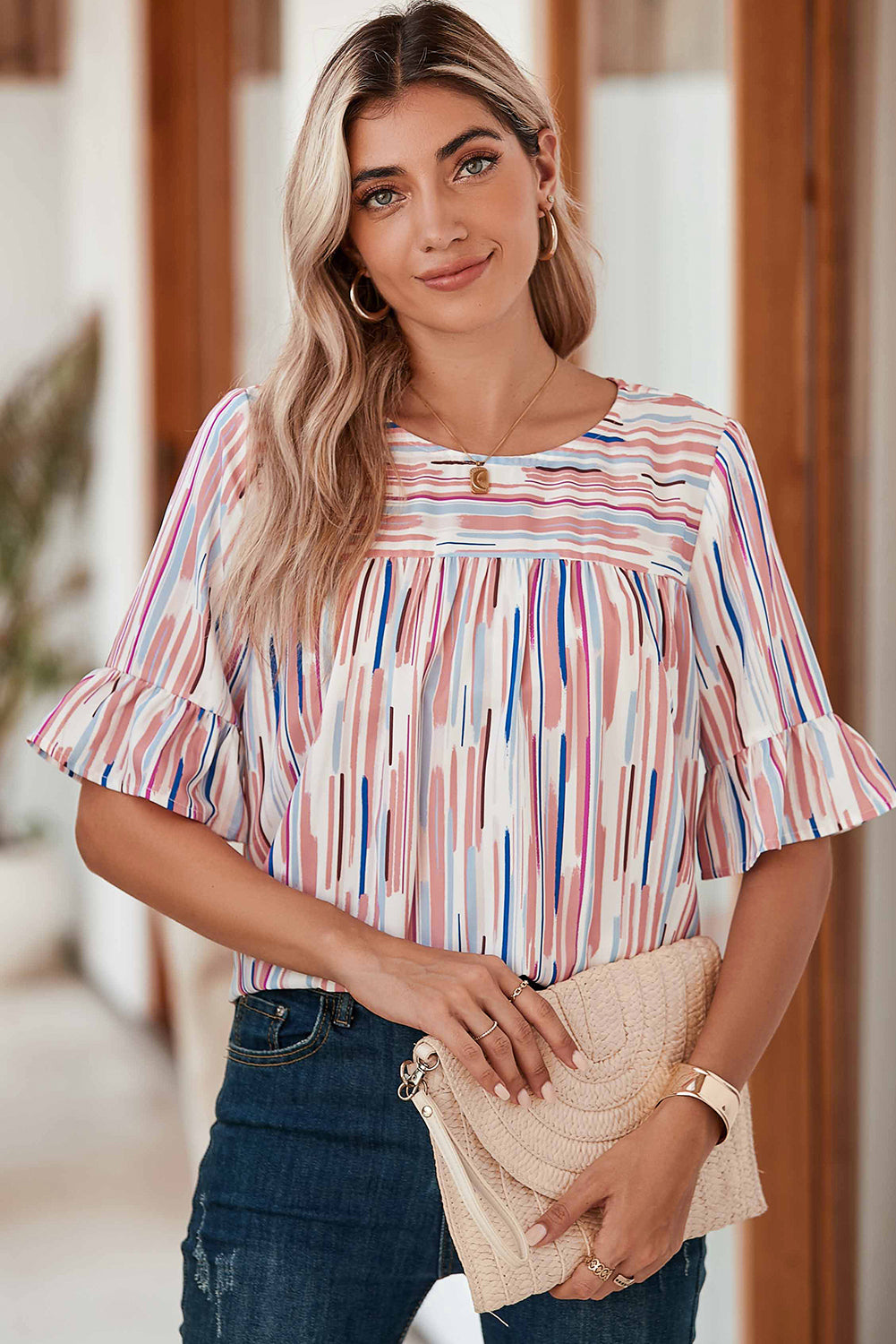 White Abstract Print Ruffle Half Sleeve BlouseMaterial:100%Polyester



		The blouse features a colorblock design, where different colors are strategically placed to create a visually striking contrast. 
	
	