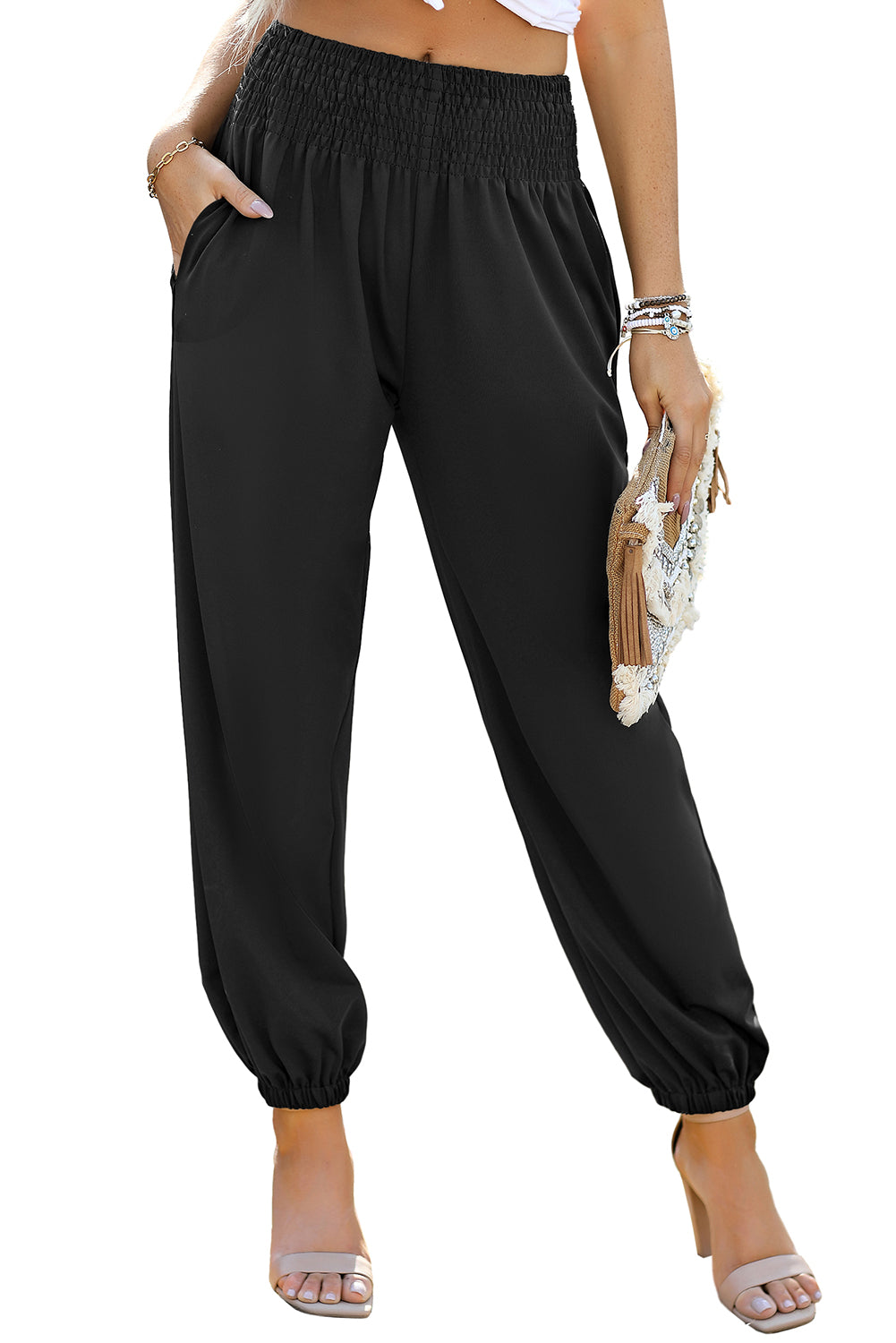 Black Pocketed Smocked High Waist JoggersMaterial:95%Polyester+5%Elastane



		These jogger pants are very cozy to wear with 95%Polyester+5%Elastane made
	
	
		The smocked design adds a stylish touch a