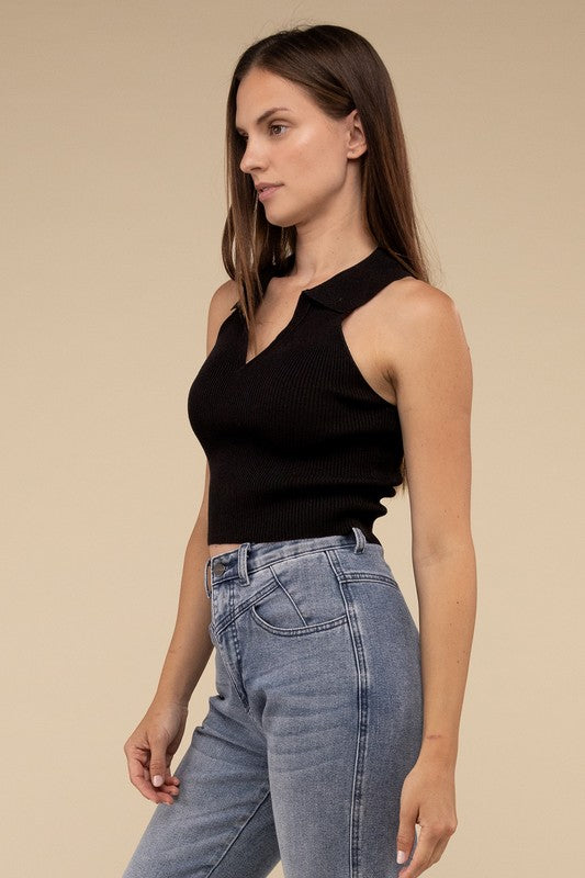 Sleeveless Collared Crop Knit TopThe Sleeveless Collared Crop Knit Top exudes timeless elegance and sophistication. Its tailored design features a classic collared neckline, adding a touch of refine