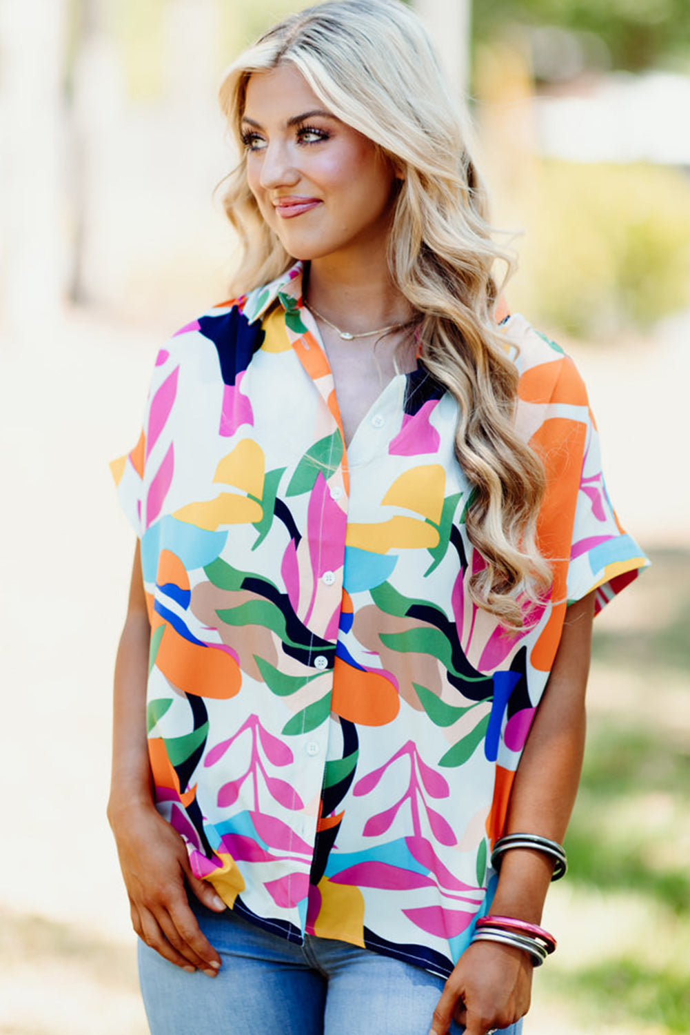 Multicolour Abstract Leaf Print Button Up Short Sleeve BlouseMaterial:100%Polyester

• Infuse your wardrobe with vibrancy in this blouse, perfect for a relaxed yet stylish look.
• The button-up design adds a touch of sophist