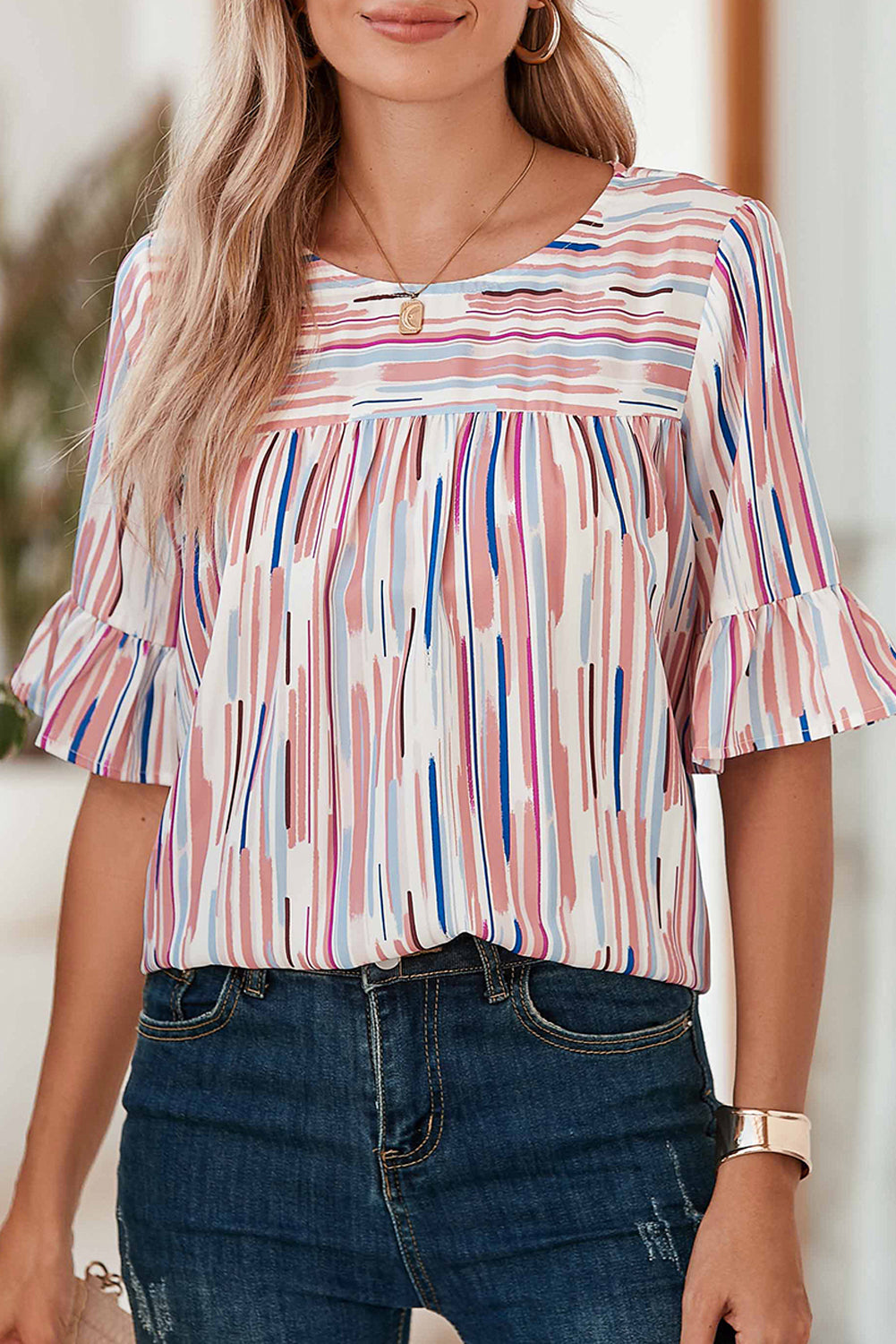 White Abstract Print Ruffle Half Sleeve BlouseMaterial:100%Polyester



		The blouse features a colorblock design, where different colors are strategically placed to create a visually striking contrast. 
	
	