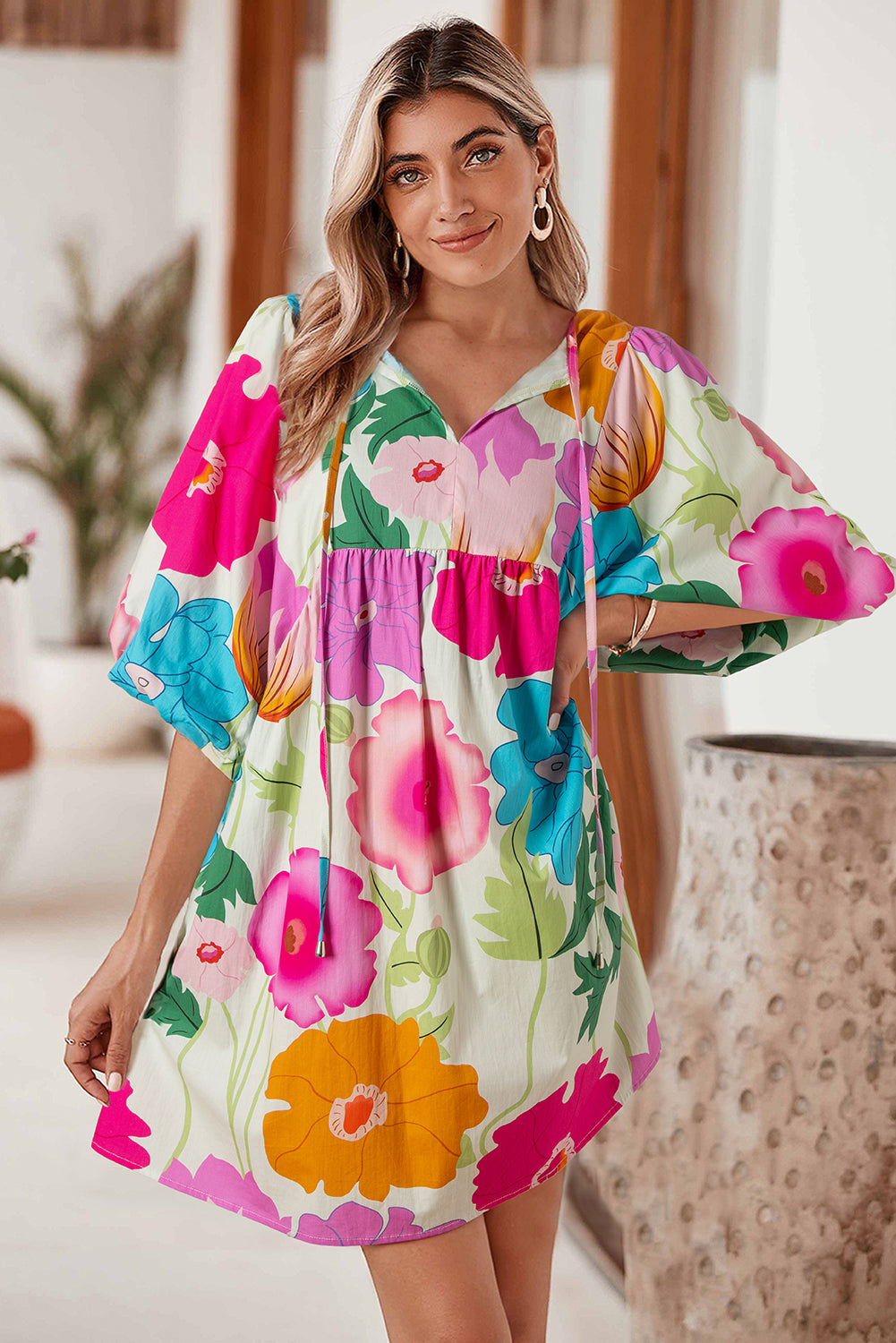 White Puff Sleeve Tied Split Neck Colorful Floral Flowy DressMaterial:100%Cotton


	


		Step into elegance with our mini dress, a vibrant and feminine piece designed to make a statement.
	
	
		This dress features charm