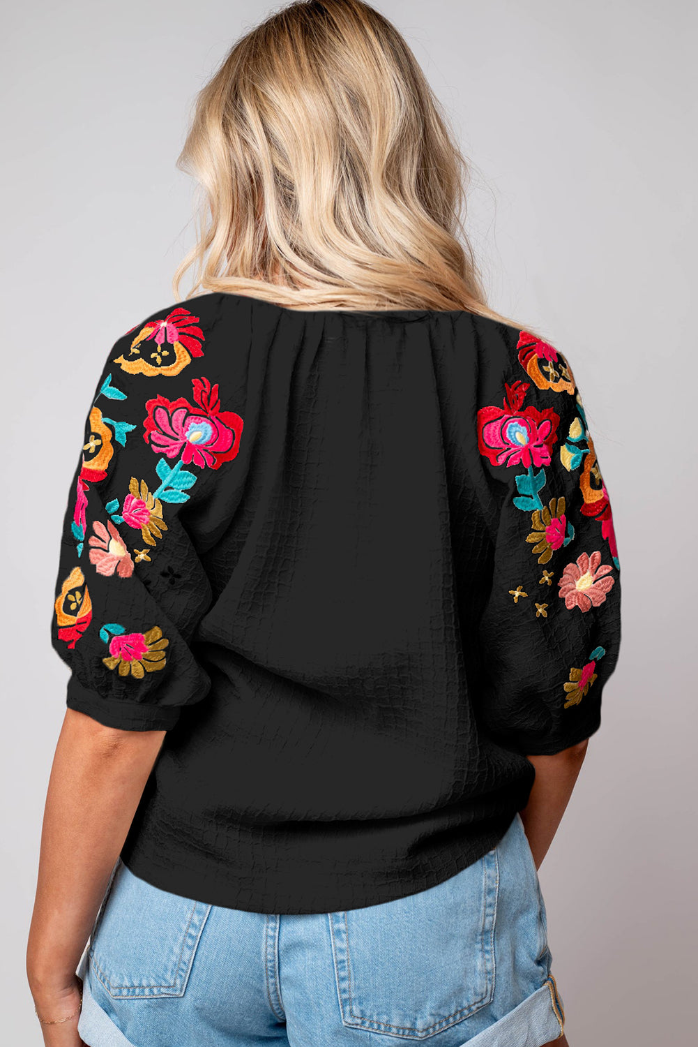 Black Floral Embroidered Ricrac Puff Sleeve Textured BlouseMaterial:100%Polyester

• Intricately detailed floral embroidery adds a touch of whimsy to the classic black hue, perfect for day-to-night transitions.
• The playf