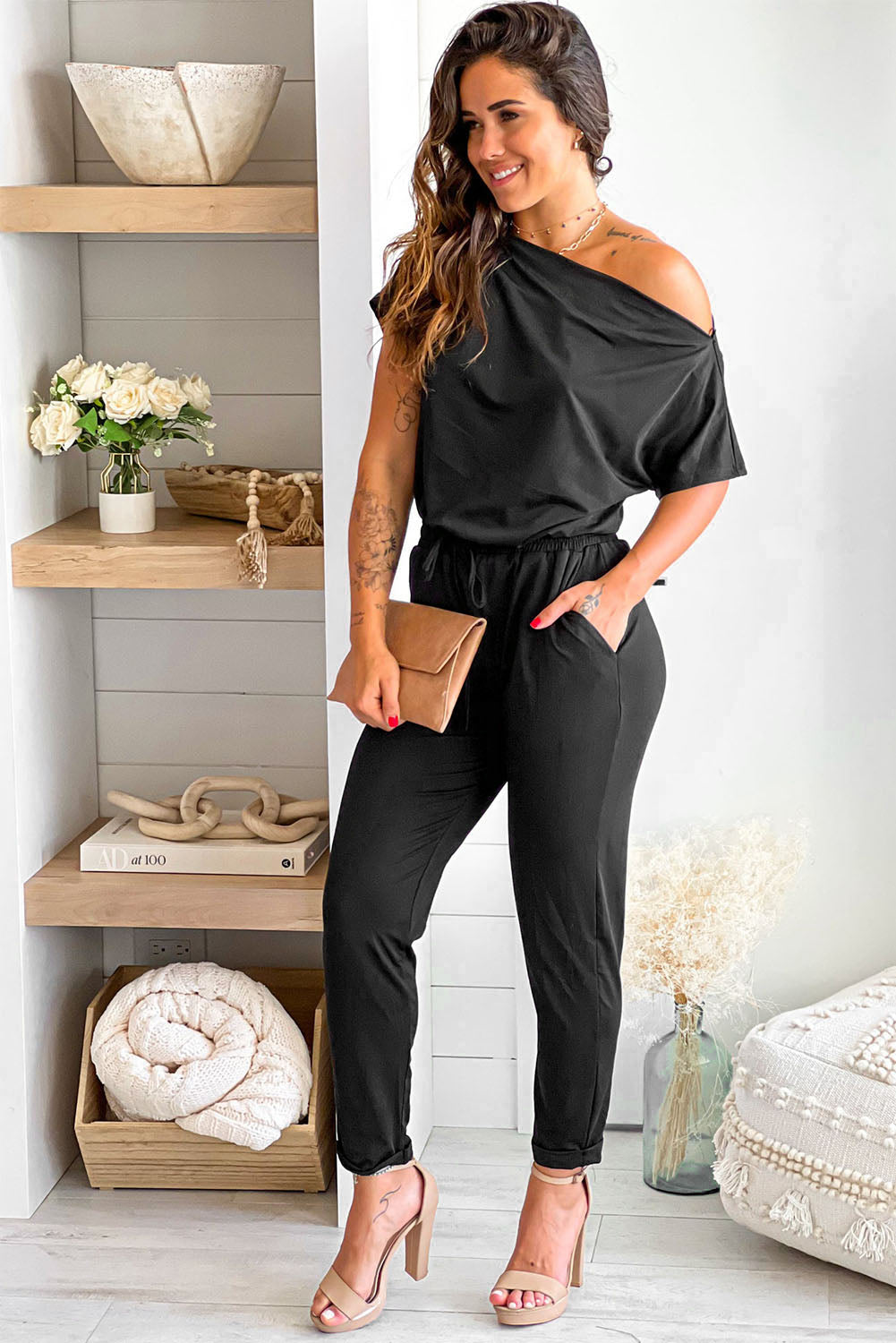 Black Tie Waist Off Shoulder Short Sleeve Tapered JumpsuitMaterial:90%Polyester+10%Elastane


	


		The short sleeves provide coverage while still allowing for ease of movement, and the tapered legs create a sleek and s